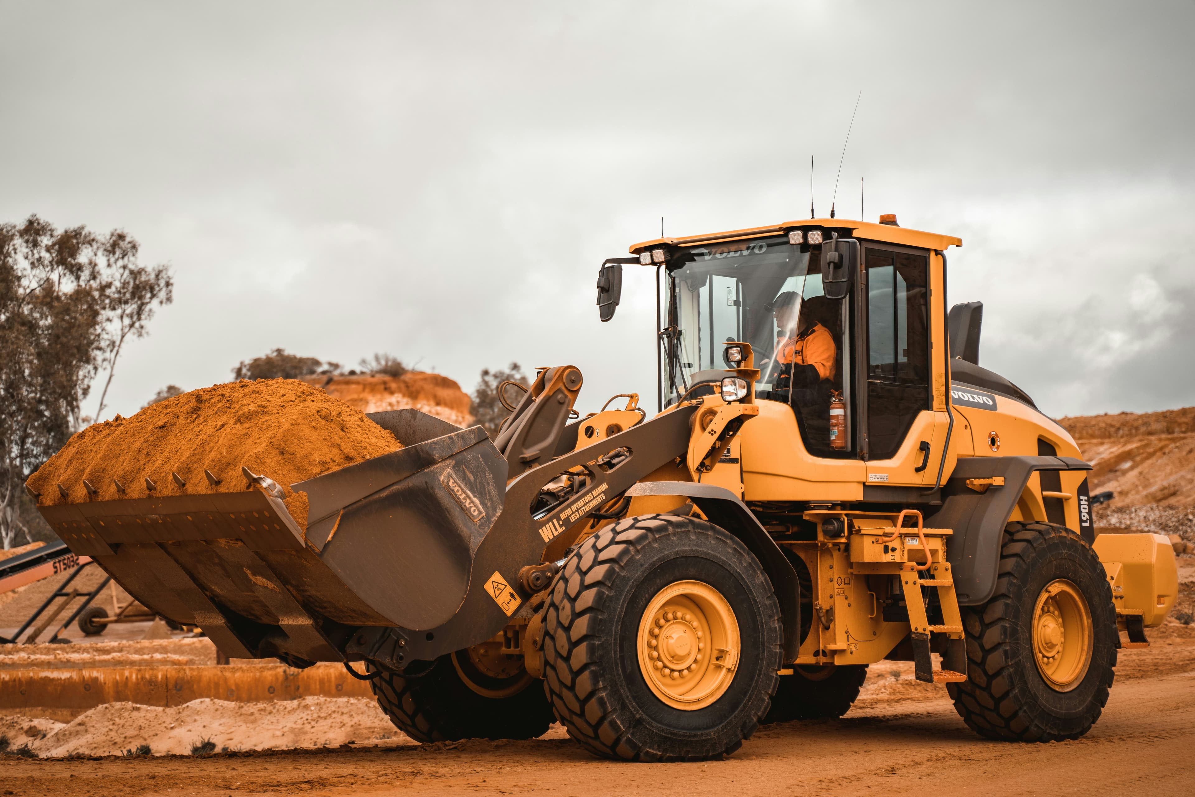 Heavy equipment on a job site at golden hour